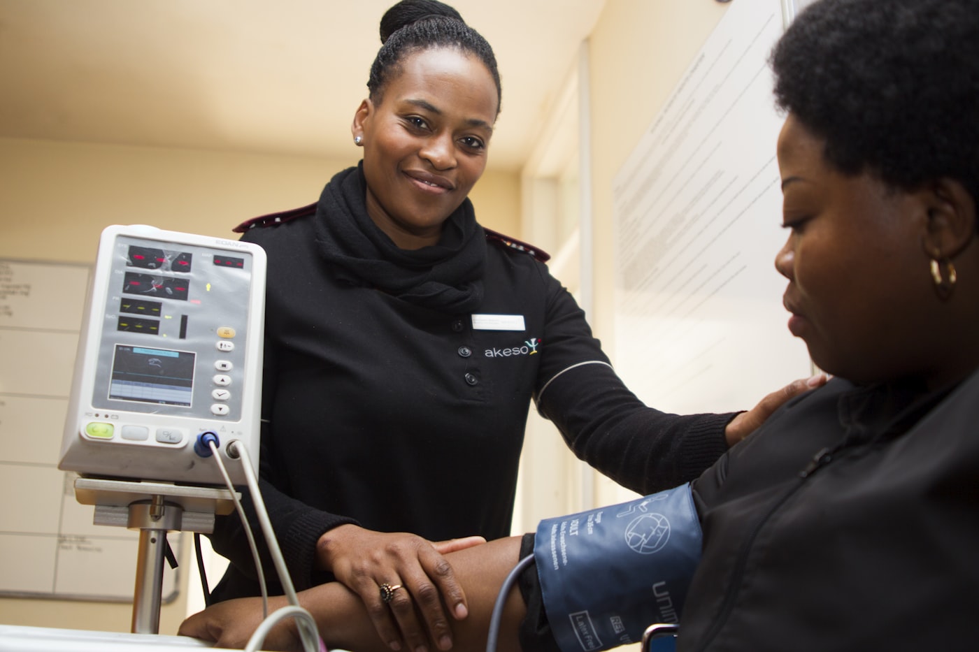 A nurse caring for a patient at home